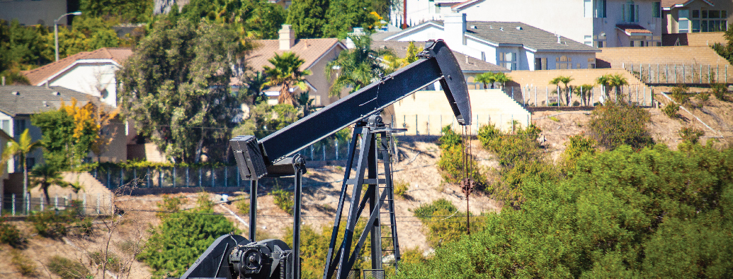 Oil pump jack near residential neighborhood